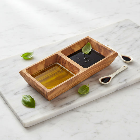 Hand carved olive wood double dipping bowl with two compartments.