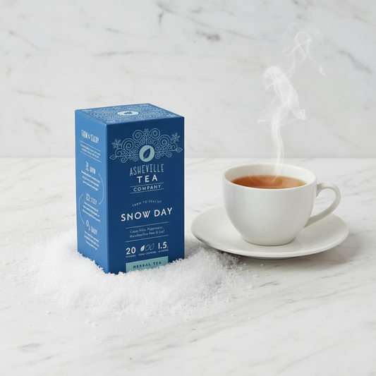 Blue box of Asheville Tea Company Snow Day herbal tea on a white background